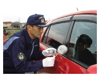 写真　高力　範明　警部補