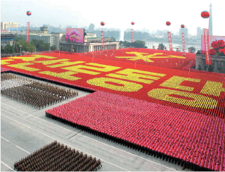 朝鮮労働党創建６５周年の記念式典（時事）